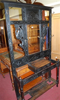 Lot 1466 - A circa 1900 ebonised and line carved oak...