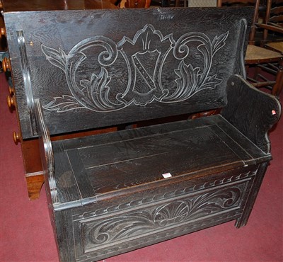 Lot 1277 - A circa 1900 ebonised and line carved oak fold-...