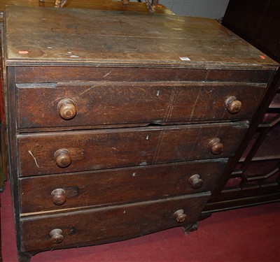 Lot 1239 - A 19th century oak chest of four long...