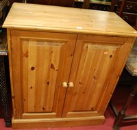 Lot 1246 - A modern pine double door side cupboard, w.87cm