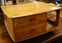 Lot 1344 - An Ercol blond elm Pandora's Box coffee table,...