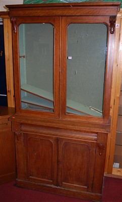 Lot 1101 - A mid-Victorian mahogany bookcase cabinet, the...