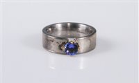 Lot 414 - A silver and tanzanite ring, the round...