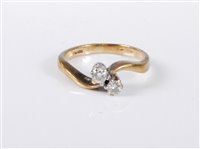 Lot 451 - A 9ct gold two stone diamond ring, the two...