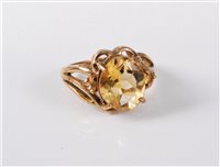 Lot 409 - A 9ct gold citrine ring, the oval citrine,...