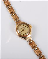 Lot 445 - A lady's 9ct gold Tissot wristwatch, the round...