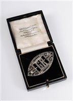 Lot 404 - A marquise silver and marcasite brooch, with...