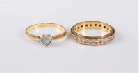 Lot 417 - Two diamond rings: a 9ct diamond eternity ring,...