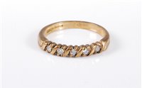 Lot 434 - A 9ct gold half hoop diamond ring, total...