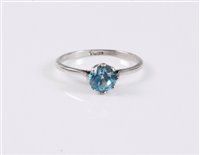 Lot 2592 - A blue zircon ring, the round pale blue zircon,...