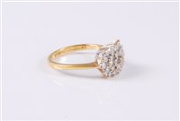 Lot 2646 - An 18ct diamond cluster ring, the diamond...