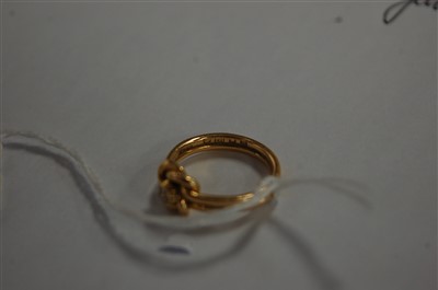Lot 2650 - An 18ct diamond knot ring, the old cut diamond,...