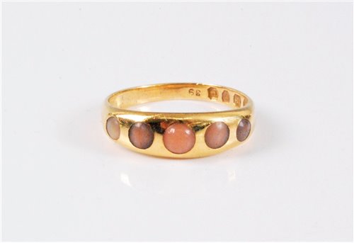 Lot 2574 - An early 20th century 18ct and coral ring, the...