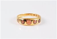 Lot 2574 - An early 20th century 18ct and coral ring, the...