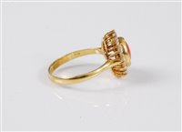 Lot 2573 - An 18ct coral and CZ ring, the oval coral...