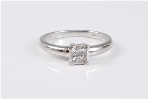 Lot 2640 - A platinum and diamond ring, the four princess...