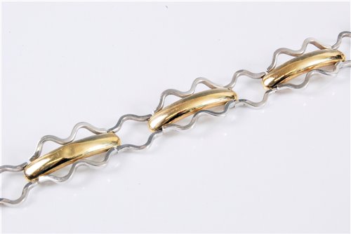 Lot 1265 - A 14ct bi-colour gold fancy link bracelet,...