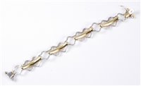 Lot 1265 - A 14ct bi-colour gold fancy link bracelet,...