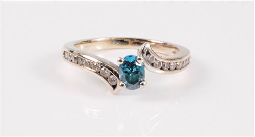 Lot 1297 - A blue and white diamond ring, the...