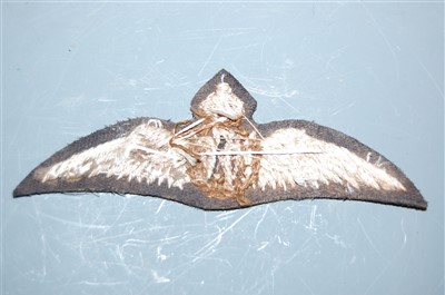Lot 130 - A post WW I RFC cloth wing badge.