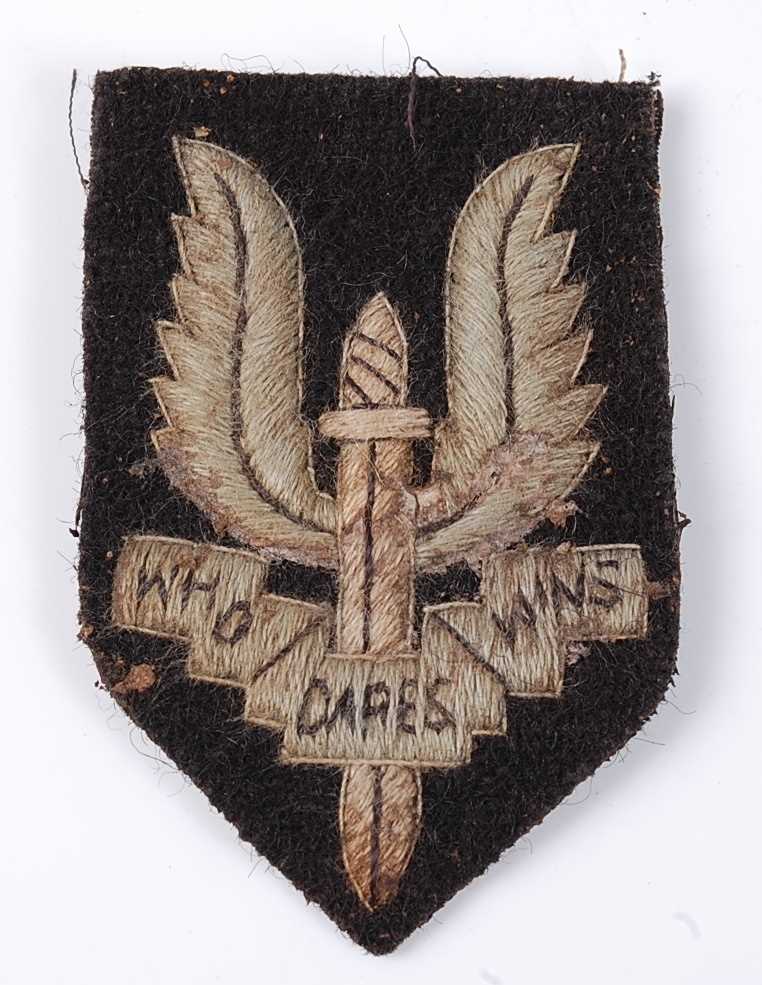 Lot 180 - An S.A.S. embroidered beret badge.