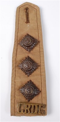 Lot 102 - A canvas shoulder strap with LRDG metal insignia.