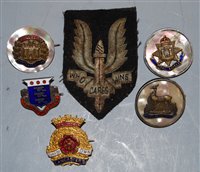 Lot 308 - A post-WWII SAS cloth cap badge; together with...