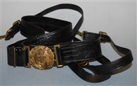 Lot 318 - A black leather naval belt with two-piece...