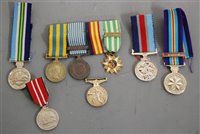 Lot 326 - A collection of eight military medals, to...