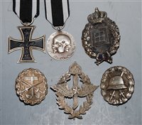 Lot 341 - A collection of six German badges and medals,...