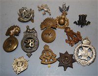 Lot 368 - A collection of assorted cap badges and...