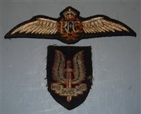 Lot 379 - A post-WWI Royal Flying Corps cloth wing badge,...