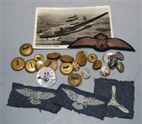 Lot 380 - A post-WWII RAF cloth wing badge, together...