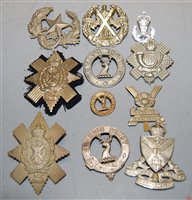 Lot 390 - Eleven various cap badges and insignia, to...