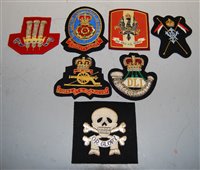 Lot 391 - A collection of seven cloth badges, to include...