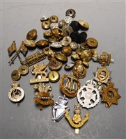 Lot 399 - A collection of assorted military cap badges,...