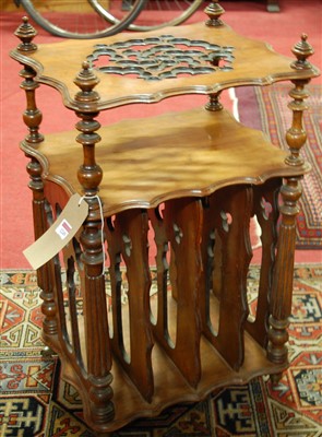 Lot 1564 - A late Victorian walnut canterbury whatnot, of...