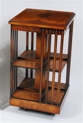 Lot 1565 - An oak and burr oak revolving bookcase, having...