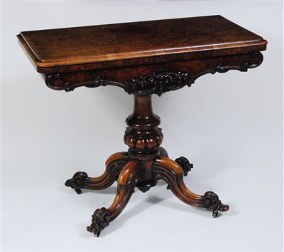 Lot 1573 - A Victorian figured and carved walnut pedestal...