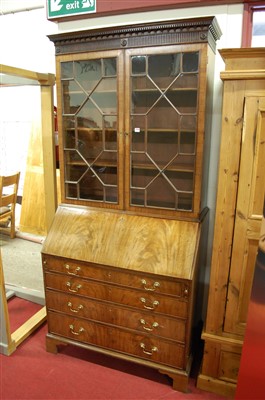 Lot 1593 - A George III mahogany bureau bookcase, having...