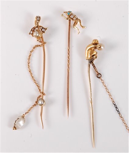 Lot 2512 - Three pearl stick pins: a seed pearl and...