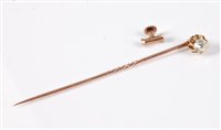 Lot 2520 - A diamond solitaire convertible stick pin: the...