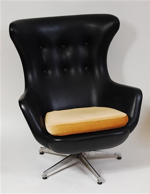 Lot 429 - A 1960s black vinyl buttonback upholstered...