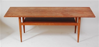 Lot 430 - A 1960s Danish faded teak long coffee table,...