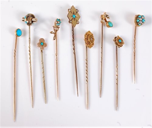 Lot 2522 - Nine stick pins: to include a 15ct diamond...