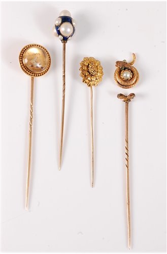 Lot 2526 - Four stick pins: to include a reverse painted...