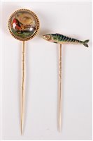 Lot 2527 - Two stick pins of sporting interest: a reverse...