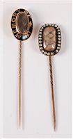 Lot 2532 - Two late 19th century mourning stick pins: an...