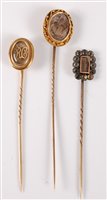 Lot 2533 - Three hairwork stick pins: an oval plaited...