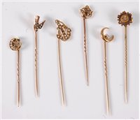 Lot 2541 - Six diamond and seed pearl stick pins: a 15ct...